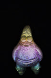 Colorful sea snail-like creature on a black background